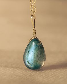 Our most classic style, this minimalist and dainty necklace is perfect for every day wear. Labradorite is a mystical and protective stone, imparting strength and perseverance in times of change. This gemstone gives off a blue flash called labradorescence which depicts the labradorite spiritual meaning of transformation and growth. This handcrafted necklaces and pendants are wrapped in 14k gold-filled. Durable Jewelry | Pendant | Gold Necklace | Durable Jewelry | Fashion & Accesories Labradorite Drop Gemstone Necklaces, Labradorite Gemstone Drop Necklaces, Labradorite Drop Necklace With Gemstone, Handmade Labradorite Drop Necklaces, Handmade Drop-shaped Labradorite Necklaces, Handmade Labradorite Drop Necklace, Labradorite Drop Jewelry For Gift, Wire Wrapped Labradorite Teardrop Pendant Necklace, Turquoise Labradorite Pendant Necklace