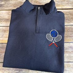 This quarter zip sweatshirt is perfect for the tennis lover in your life. The tennis design is embroidered on the left chest, and the initials of the lucky recipient are embroidered in the middle of the design. This sweatshirt is sure to keep them warm on those chilly days on the court. Made from a super soft cotton blend, this sweatshirt is also machine washable for easy care. Order yours today and be the hit of the tennis season! Unisex Sized  Fleece-lined collar 1x1 ribbed cuffs and waistband Sporty Sweatshirt With Letter Embroidery For Sports, Sporty Long Sleeve Sweatshirt For Tennis, Sporty Long Sleeve Tennis Sweatshirt, Tennis Sweatshirt, Tennis Design, Tennis Life, Tennis Gear, Tennis Shirt, Cool Bag