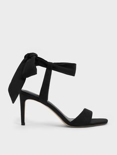 To add feminine flair to your outfits, these sandals will do the job. The open-toed style is elegant in its minimal appeal, especially when paired with dainty tie-around ankle straps. They will accentuate your ankles and ensure a secure fit at the same time. With its black suede finish, it will go well with most outfits while exuding a refined air. Maximise the flirty appeal of these shoes by wearing them with a mini skirt -- with its slender 8cm heels, they will give you a flattering stature bo Elegant Black Lace-up Sandals With Ankle Tie, Elegant Fitted Lace-up Sandals For Summer, Chic Fitted Open Toe Lace-up Sandals, Elegant Fitted Lace-up Sandals With Ankle Strap, Chic Ankle Tie Heels For Evening, Chic Evening Heels With Ankle Tie, Chic High Heel Lace-up Sandals For Formal Occasions, Elegant Open Toe Lace-up Sandals With Strap, Trendy Evening Sandals With Straps