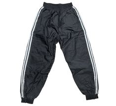 •100% Nylon Out Shell, 100% Polyester Inside Lining • Elastic Waist • Elastic ankle with a zippper • Pockets • Black with 2 stripes on Legs Nylon Sports Bottoms With Side Stripes, Sporty Pants With Zip Fly For Sports, Forearm Guard, Sparring Gear, Karate Belt, Belt Rack, Boxing Bags, Boxing Shorts, Training Gear