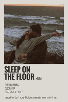 an advertisement for sleep on the floor, featuring two people hugging and looking at the ocean