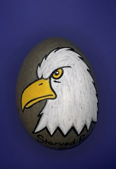 an eagle painted on top of a rock