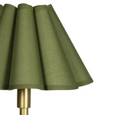 a green lampshade on a white background with a gold colored metal base and fabric shade