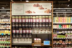 a store filled with lots of different types of food and drinks on shelves next to each other