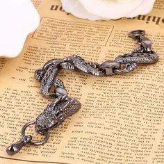 A legendary bracelet inspired by ancient myths of Naga dragons.This durable metal bracelet is easily fastened using a lobster-style clasp. Materials: Plated Zinc AlloyLength: ~20cm (1.8")Clasp Type: Lobster Clasp Click ADD TO CART To Order Yours Now! The Checkout Process is Guaranteed to be 100% Safe and Secure with Visa, Mastercard, AMex, Discover, Apple Pay or PayPal. Snake-shaped Metal Bracelets As Gifts, Gunmetal Jewelry With Lobster Clasp In Metal, Silver Metal Snake Bracelets, Silver Metal Snake Bracelet, Metal Bangle Bracelet With Lobster Clasp, Symbolic Metal Bracelet With Lobster Clasp, Naga Dragon, Dragon Wolf, Bracelets Chain