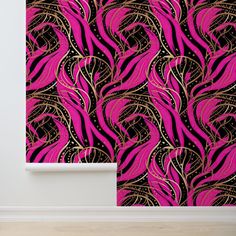 a pink and black wallpaper with gold swirls on the side, in an empty room