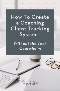 a desk with a laptop, pen and glasses on it that says how to create a coaching client tracking system without the tech overwhelm