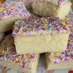 there are many pieces of cake with sprinkles on it