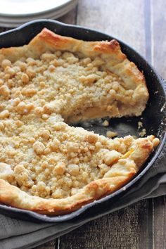 a pie in a cast iron pan on a wooden table