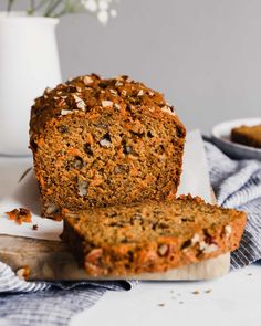 sliced carrot bread sitting on top of a cutting board