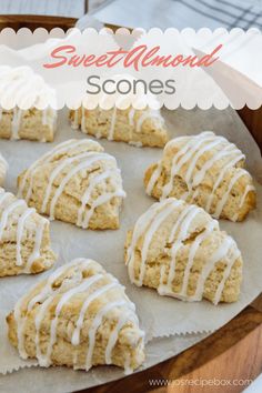 sweet almond scones with white icing on a wooden platter and text overlay that says sweet almond scones