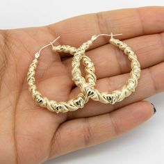 "1 3/8\" Graduated Diamond Cut Kisses & Hearts Hoop Earrings Real 10K Yellow Gold * Metal : Real 10K Yellow Gold (Properly Stamped, 10K)  * Condition : Brand New  * Finish : Polished  * Average Weight : 4.19 grams  * Length : 1 3/8\" = 36mm  * Width : 1/4\" to 3/32\" = 6.7mm to 3.6mm  * Clasp/Bail : Hinged All of our items are brand new and are shipped with a gift box." Earrings Real, Heart Hoop Earrings, Average Weight, Jewelry Business, Jewelry Earrings Hoops, Fine Jewellery Earrings, Buying Jewelry, Diamond Cut, Ring Bracelet