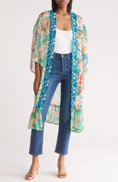 , layered look. ultrachicVivacious printing blooms across a lightweight duster featuring dramatic wide sleeves for an Open front Three-quarter sleeves 100% polyester Hand wash, dry flat Imported Blue Floral Print Summer Outerwear, Summer Blue Floral Print Outerwear, Spring Beach Outerwear With 3/4 Sleeves, Floral Print Open Front Outerwear For Layering, Summer Beach Outerwear With 3/4 Sleeve, Bohemian Summer Outerwear With 3/4 Sleeves, Beach Outerwear For Spring With 3/4 Sleeves, Bohemian Outerwear With 3/4 Sleeves For Summer, Spring Floral Print Outerwear With Kimono Sleeves