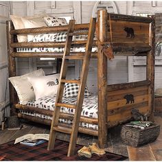 a wooden bunk bed sitting next to a pile of pillows on top of a rug