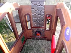 an outdoor play area with a fire place