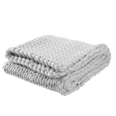 two white blankets stacked on top of each other in front of a white background and one is