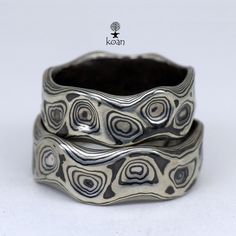 "These are unique mokume gane forged wedding or engagement rings, made of 14K white gold and sterling silver (oxidized). Can be ordered in pair as well as separatly up to your preferences in size, width, thikness and design. They are 100% handmade forged. The price will depend on final weight of the rings.  Koan mokume gane jewellery My name is Andrew Seginovich, designer, maker and creator of Koan Mokume gane Jewelry. Welcome to my shop! The studio was created in 2005, and since that time I've been seeking the most interesting, inspiring and beautiful designs to make you happy. I hope you will enjoy my work and I promise to do my best to make you satisfied. The main technique I work in is mokume gane - wooden texture in metal. Mokume-gane (木目金 Mokumegane) is a Japanese metalworking proced Silver Patina Jewelry For Weddings, Mode Hippie, Rings Etsy, Mokume Gane, בר מצווה, Textured Ring