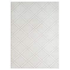 a white rug with diamond shapes on it