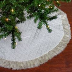 a christmas tree skirt with lights on it