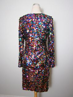 "This is a BOLD and FUN little dress from Oleg Cassini Black Tie. It's fully embellished with multicolored paillette sequins and is in perfect condition! Note, there's some stretch in the material. Bust - 36-40\" Waist - 28-32\" Hips - 38-42\" Length - 37\" Tag Size - 10 This dress comes from a pet-free and smoke-free home. If you would like more info or have any questions, please don't hesitate to ask!" Oleg Cassini, Rainbow Dress, Little Dresses, Embellished Dress, Dress Vintage, Black Tie, Sequin Dress, Confetti, Vintage Dresses