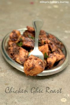 a plate full of food with a fork stuck in it's side and the words chicken ghee roast on top