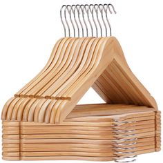 wooden clothes hangers stacked on top of each other