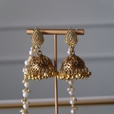 German Silver Gold Plated Paan Shaped Stud Bahubali Jhumka Earrings With Pearl Earchain. Detachable Chain. Bahubali Earrings Gold, Gold Jhumkas With Latkans For Party, Traditional Bridal Earrings With Latkans, White Bohemian Jhumkas For Celebration, Chandbali Jhumkas For Navratri Festival, Navratri Festive Jhumkas With Latkans, Traditional Metal Bridal Earrings With Latkans, Bridal Latkan Earrings For Navratri Festive, Party Jhumkas With Latkans For Festivals