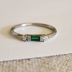 New 925 Silver Filled Emerald Diamond Band Stacking Ring For Women Stamped 925. All Gemstones Are Simulated. A Jewelry Box Included. Ready To Ship Same Day. Feel Free To Ask Any Question. All Photos Are Real Time From Actual Object No Stock Photo Used. Color Might Be Slightly Different Due To Lighting. White Gold Sterling Silver Emerald Ring, White Gold Emerald Ring In Sterling Silver, Classic Silver Emerald Ring With Accent Stones, Silver Emerald Ring In 14k White Gold, Silver Sterling Silver Emerald Ring For Formal Occasions, Fine Jewelry Sterling Silver Stackable May Birthstone Rings, Silver Stackable Rings With Emerald-cut Gemstone, Silver Emerald Cut Gemstone Stackable Rings, Elegant Stackable Emerald Ring In Sterling Silver