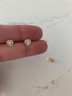 "14K Heart Cubic ZC Earrings, Dainty Earrings | Women Earrings | Kid Earrings | Gold Hearts | Push Back Studs | Gold Heart Earrings | Dainty Studs | Free Shipping Beautiful, elegant and classic heart cut studs ♦ Materials: 14K Gold, Cubic Zirconia ♦ Available colors: 14K Yellow Gold ♦ Closure: Push Backs ♦ Earrings Measurements: 5 Millimeters -------------------------------------------------- ♦ -------------------------------------------------- MATERIALS 14K Gold PRODUCTION TIMES Order processin Heart Charm Round Earrings For Anniversary, Anniversary Earrings With Heart Charm, Single 14k Gold Heart Earring For Anniversary, Hypoallergenic 14k Gold Heart Cut Earrings, Hypoallergenic Heart Cut 14k Gold Earrings, 14k Gold Double Heart Earrings For Wedding, Dainty Single Heart Earring For Anniversary, Gold Heart-shaped Earrings With Diamond Accents, Heart Cut Earrings With Heart Beads For Anniversary