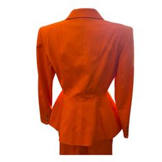 This exquisite MONTANA Orange Skirt Suit features a bold design from iconic designer Claude Montana. The perfect power suit for an elegant, confident look, this set includes a blazer and pencil skirt in size 42. Timeless and stylish, you'll look stunning in this designer statement piece. If you have an inquiry or specific questions for this archive piece: Please send us a chat on our website or send an email to info@theremoda.com We are happy to assist in the best way possible! How you can pay f Fitted Career Suits With Suit Collar, Fitted Suits With Suit Collar, Classic Fitted Career Sets, Classic Fitted Sets For Career, Classic Orange Blazer For Workwear, Classic Orange Blazer For Work, Tailored Orange Office Blazer, Orange Fitted Blazer For Work, Tailored Skirt Suit For Formal Occasions