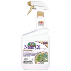 a bottle of neant oil on a white background with a gold cap and plastic handle