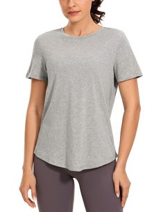 a woman in grey shirt and leggings