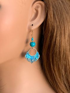 Enhance your style wearing these blue cute dangle earrings!  The handmade turquoise blue earrings are approximately 2.25 inches long.  The Boho earrings are lightweight and have simple gold-filled ear wires.  Hand patinaed brass dangles are topped with real Turquoise beads, gold-plated bead caps and seed beads.  The lovely earrings will be a welcome addition to your jewelry collection or will make a great gift idea for someone with pierced ears.  Also available as clip on earrings. These earring Blue Dangle Hoop Earrings Hypoallergenic, Bohemian Blue Hypoallergenic Hoop Earrings, Handmade Blue Dangle Hoop Earrings, Bohemian Blue Beaded Hypoallergenic Earrings, Bohemian Blue Hypoallergenic Beaded Earrings, Bohemian Blue Hypoallergenic Jewelry, Turquoise Drop Chandelier Earrings With Ear Wire, Turquoise Hypoallergenic Beaded Drop Earrings, Turquoise Chandelier Drop Earrings