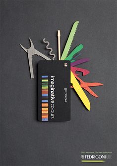 the scissors are next to some colored strips