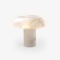 a white marble table lamp on a white background