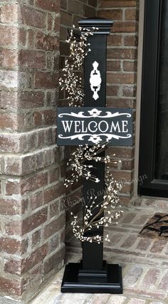 a welcome sign on the front door of a house