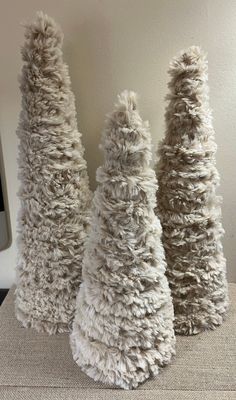 "Beautiful tan/ivory mix   handmade trees set of (3)  Faux tree, can be used as centerpiece, or placed on Christmas tree. Or use as a wreath embellishment Note listing is only for the Mini Trees. Lollipops listed in my shop.  Dimensions  14\" 12 \" 11\"" Fur Christmas Trees, Christmas Tree Yarn, Yarn Christmas Tree, Primitive Christmas Tree, Christmas Decor Rustic, Rustic Winter Decor, Yarn Trees, Fur Tree, Christmas Cones