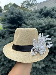 Panama hat / fedora straw hat decorated with a handmade beaded pearl tembleque flowers. This hat is perfect to cover yourself from the sun and show your Panamanian pride at the same time —- Very chic and cute style... will match all your outfits Elegant Handmade Fedora For Beach, Bohemian Fedora Straw Hat For Parties, Elegant Handmade Panama Hat For The Beach, Elegant Handmade Panama Hat For Beach, Summer Fedora Panama Hat For Party, Summer Panama Fedora Hat For Party, Summer Fedora With Curved Brim For Party, Summer Party Fedora Straw Hat, Summer Party Fedora With Brim