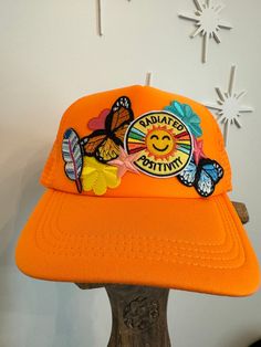 All the fun and positive patches on this trucker hat with accent patches. Fun and funky fashion! Cheap Multicolor Fun Trucker Hat, Novelty Trucker Hat For Streetwear, Fun Adjustable Trucker Hat With Embroidered Patch, Trendy Trucker Hat With Patches, Fun Summer Trucker Hat With Embroidered Patch, Novelty Streetwear Trucker Hat, Funky Fashion, Beanie Hats, Trucker Cap