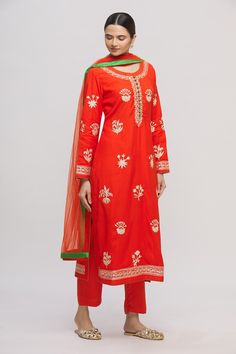 Red tinted orange straight long kurta with all-over floral motif gold tone gota work. Comes with pants and dupatta.
Components:3
Embroidered
Neckline:Round
Sleeve Length:Full
Fabric:
Color:Red
Green loop button placket
Side slits
Cuff sleeves
 - Aza Fashions Red Kurta, Long Kurta, Kurta Set For Women, Gota Work, Embroidered Neckline, Kurta Set, Cuff Sleeves, Aza Fashion, Button Placket