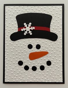 a card with a snowman's hat and polka dot dots on it,