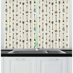 a kitchen curtain with an arrow pattern on it