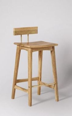 a wooden stool with a backrest and seat made out of wood, against a white background