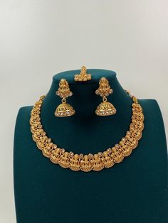 This exquisite piece of craftsmanship comes from our Traditional collection. Very Elegant and stylish, this necklace can be paired with any Attire depending upon the occasion and the theme. Finish: 24 grams gold finish Necklace Fastening: Adjustable Dori Earring Fastening: Push Back Contains: 1 necklace, 1 pair of earrings Luxury Temple Necklace With Cutdana For Celebration, Luxury Round Temple Necklace For Festive Occasions, Luxury Heavy Temple Necklace For Puja, Luxury Hallmarked Yellow Gold Temple Necklace, Luxury Hallmarked Temple Necklace For Diwali, Kameswari Jewellers Dasavataram Necklace, Intricate Design Necklace For Marriage And Diwali, Intricate Diwali Necklace For Marriage, Intricate Design Necklace For Marriage During Diwali