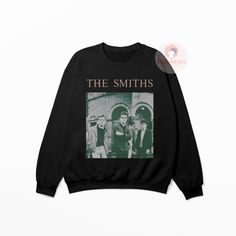 🌟 Welcome to TeenomenalApparels! 🌟 Dive into the nostalgia of the 80s with our handcrafted, vintage-inspired The Smiths sweatshirt. Perfect for music enthusiasts and trendsetters alike! 🎵 FEATURES: 🌟Unique The Smiths Design: Embrace the iconic legacy of The Smiths with our exclusively designed sweatshirt. A must-have for fans and collectors. 🌟Eco-Friendly Material: Made with 100% organic cotton, ensuring comfort and sustainability. Soft, breathable, and perfect for all seasons. 🌟Unisex Fit Retro Graphic Print Sweatshirt For Concerts, Retro Crew Neck Sweatshirt For Concerts, Band Merch Sweatshirt For Concerts, Band Merch Sweatshirt With Screen Print, The Smiths Merch, Pop Rock Music, The Smiths, Abstract Graphic, Music Band