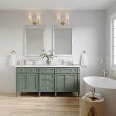 a large bathroom with two sinks and mirrors