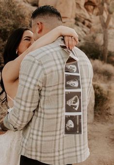 a man and woman embracing each other in front of some desert rocks with their faces on the neck tie