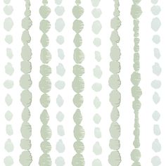 a white and green striped wallpaper with circles