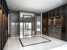 an empty room with wooden cabinets and glass doors