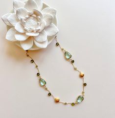 Understated yet elegant and exquisitely handcrafted, our Green Amethyst Gold Bezel Chain necklace features 3 beautiful green amethyst bezel gemstones accented with gold, peridot and forest green peridot quartz stones. Made with 14k gold plated over Italian fine silver, necklace chain is adjustable from 16-18" with a secure spring ring clasp. Gold Peridot Jewelry With Gemstone Accents, Peridot Jewelry With Gemstone Accents In Gold, Gold Jewelry With Green Amethyst Birthstone, Elegant Peridot Jewelry With Natural Stones, Gold Necklace With Green Amethyst Gemstone, Green Amethyst Jewelry With Natural Stones, Round Green Amethyst Jewelry With Gemstone Accents, Gold Gemstone Necklace, Silver Necklace Chain